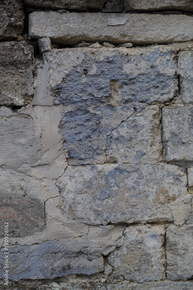Fragment of the ancient wall. Texture. Masonry. Vertical frame Fragment of the ancient wall. Texture. Masonry. Vertical frame