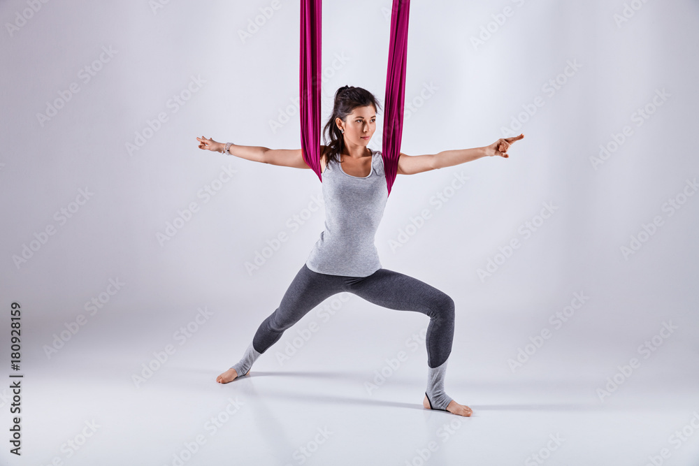 Aerial different inversion yoga in a hammock