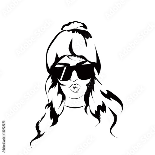 Sexy and funny fashion girl wearing sunglasses and hat and blowing a kiss.