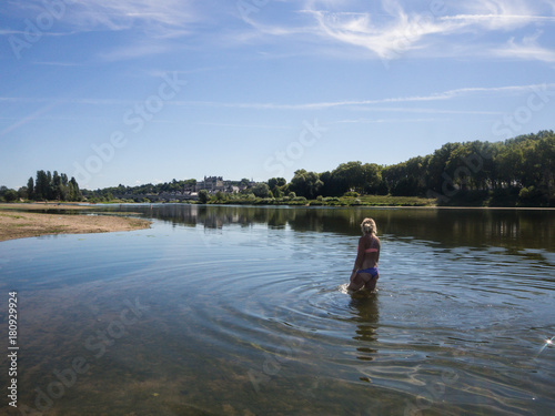 Blonde Girl bathing in the river Loire, France