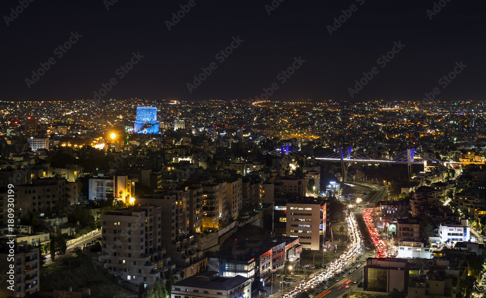 Abdoun bridge and Amman mountains at night