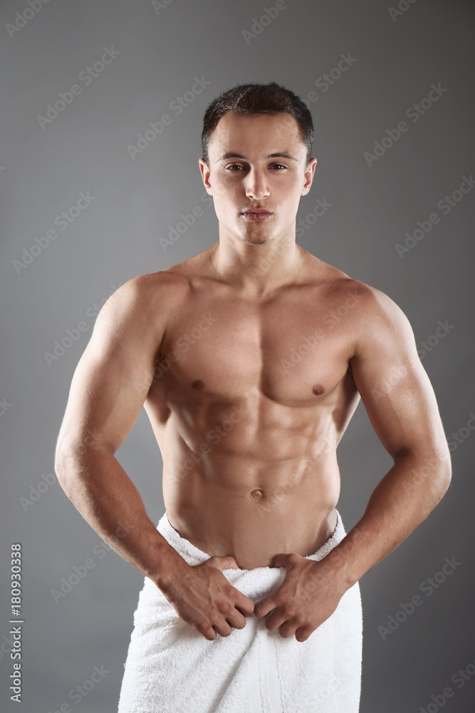 Sporty young man on color background