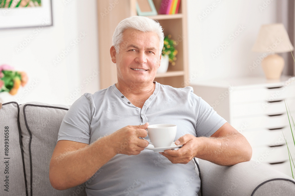 Handsome mature man with coffee at home Handsome mature man with coffee at home