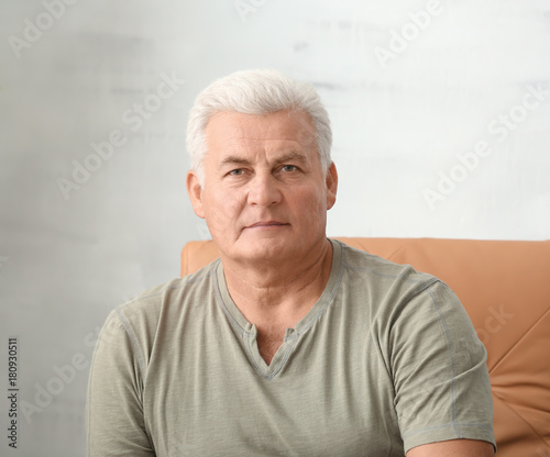 Handsome mature man at home