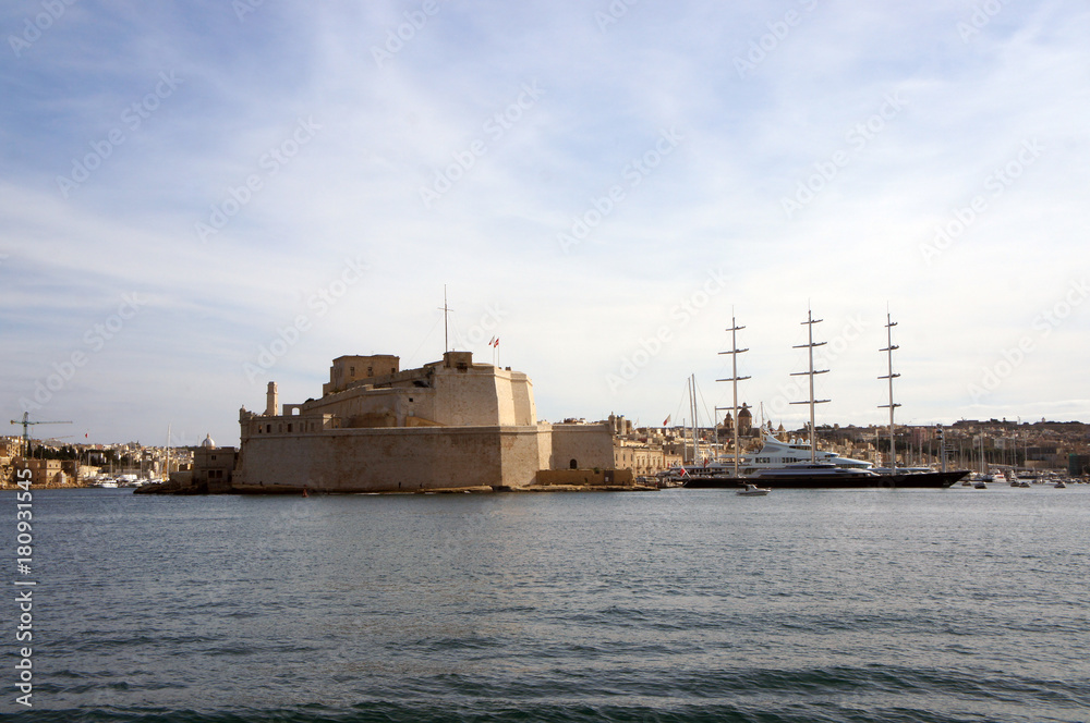 Panorama of Grand Harbor and Birgu (Vittoriosa) - Three Cities in Malta with Fort Saint Angelo and luxury yachts