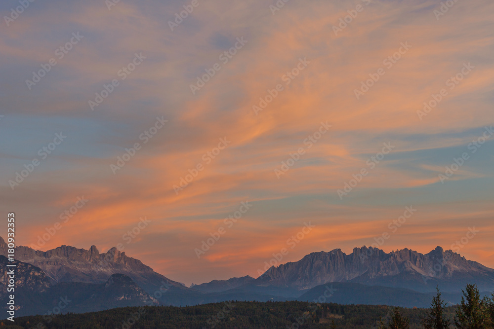 Amazing colorful clouds during autumnal sunset, Catinaccio/Rosengarten and Latemar, Alto Adige/South Tyrol, Italy