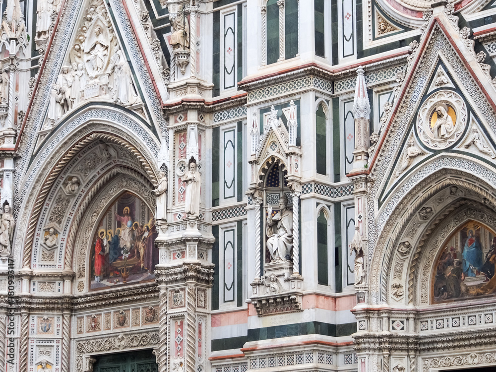 Statues and stone work on the facade of the Duomo in Florence, Italy