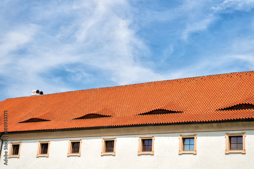 House roof with terracotta tiles in Prague, Czech Republic