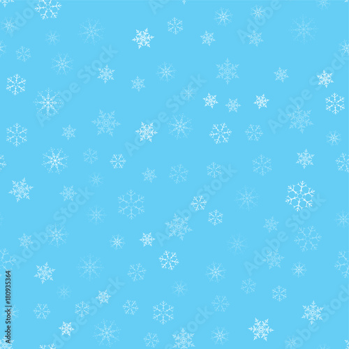 Christmas abstract background from white snowflakes on blue. Seamless pattern for design cards, posters, greeting for the new year.