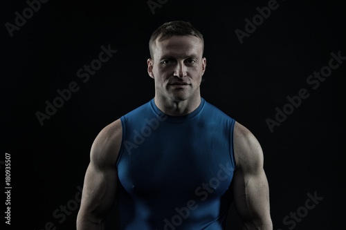 Coach sportsman in vest on chest.