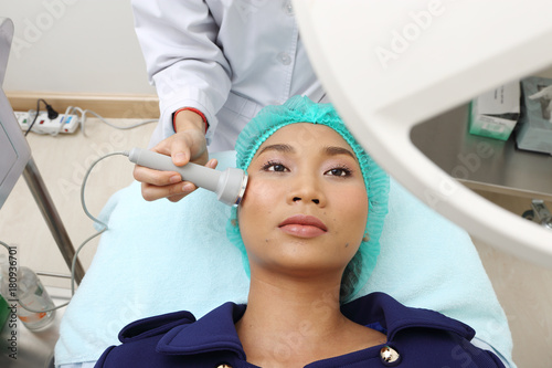 Treatment on Asian Woman as patient to make skin smooth bright