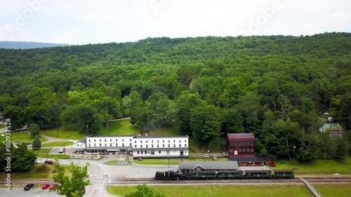 Overall aerial view of Cass State Park in West Virginia, WV, with the Shay engine at the station and loaded with tourists for the steam train ride to the top of the mountain. photo