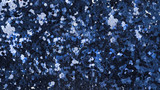 Sequins background texture in dark indigo blue. Long horizontal dimension