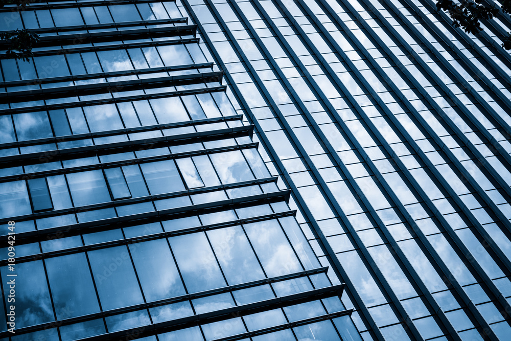 Clouds Reflected in Windows of Modern Office Building.. Clouds Reflected in Windows of Modern Office Building..
