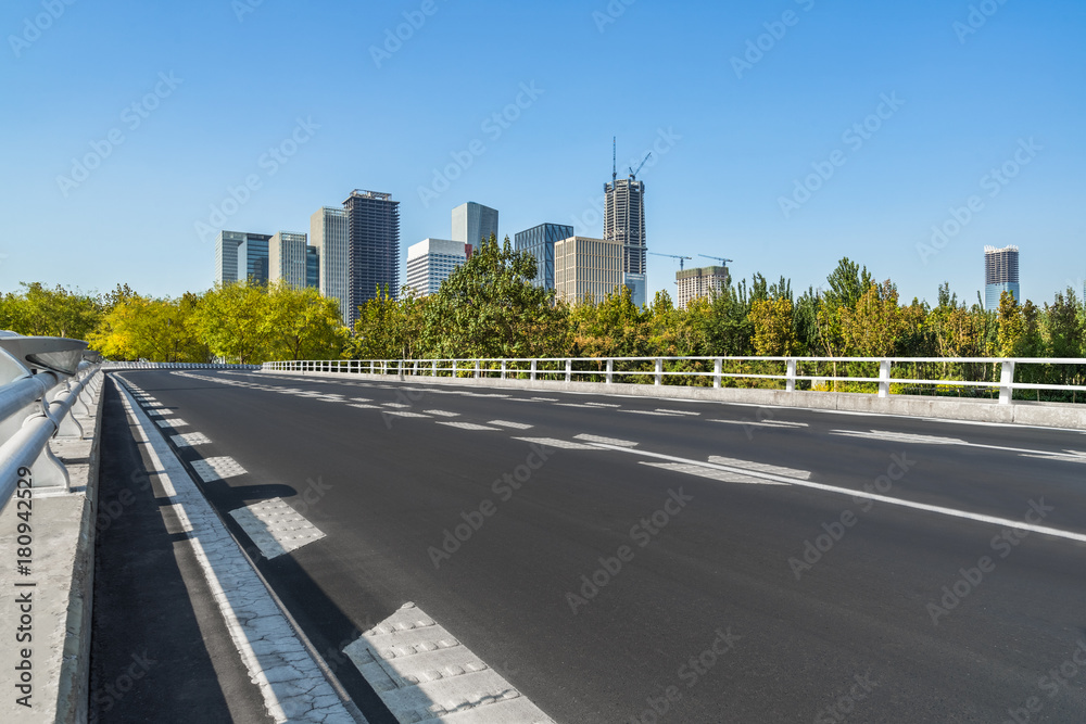 cityscape and skyline of tianjin from empty asphalt road