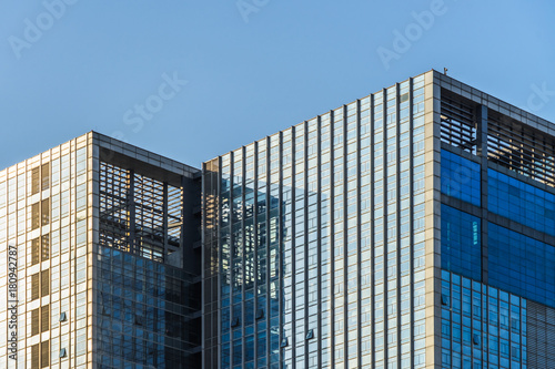 Modern office building on a clear sky background.