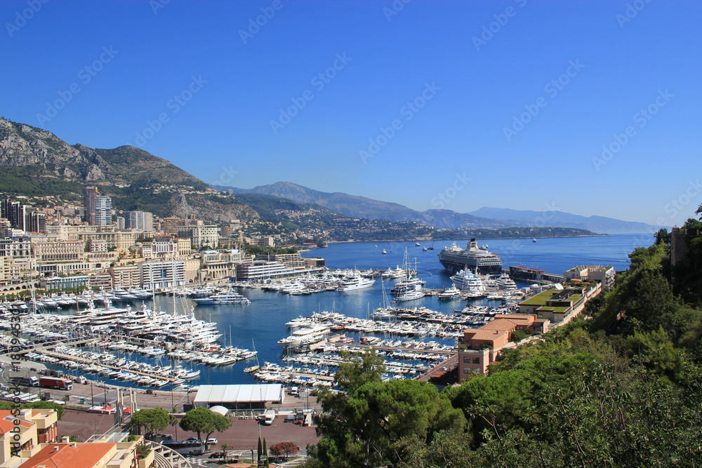 view of the port in Monaco with blue skies and water and boats