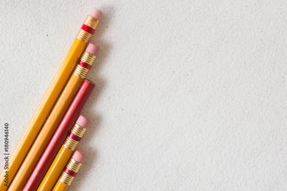red wood pencil in the middle of orange wood pencils in diagonal, diversity red wood pencil in the middle of orange wood pencils in diagonal, diversity