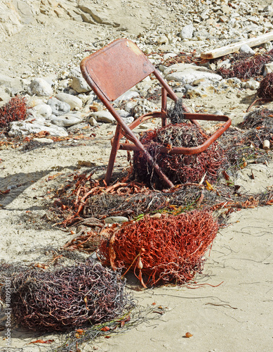 Rusty Chair on Beach