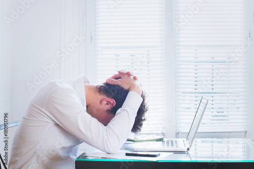 Billede på lærred emotional burnout, tired businessman at workplace in the office, stress concept