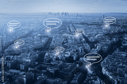 Картината върху платно online communication concept, social network with speech bubbles on blue citysca