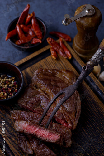 Fototapeta Naklejka Na Ścianę i Meble -  Sliced grilled steak and pepper