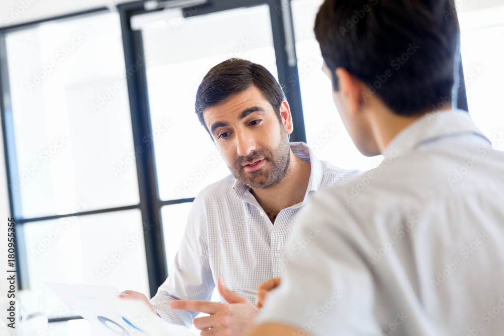 Image of two young business people in office Image of two young business people in office