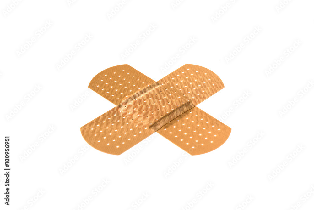Two crossed adhesive bandages Two crossed adhesive bandages