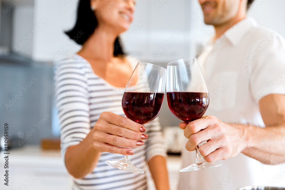 Portrait of a couple having a glass of red wine