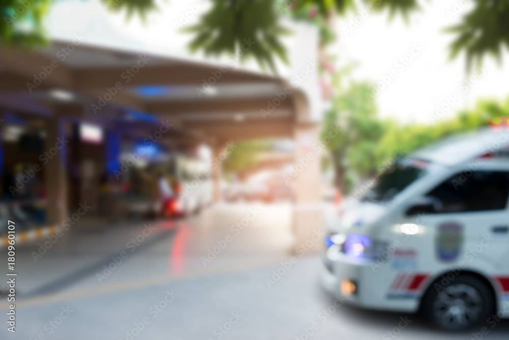 Defocused of ambulances ..Ambulances with emergency light at city hospital ,blurred for background. Defocused of ambulances ..Ambulances with emergency light at city hospital ,blurred for background.