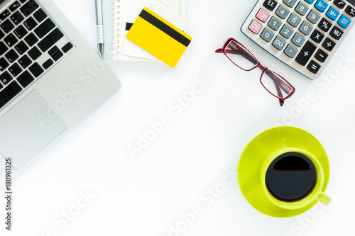 Top view of using credit card and digital tablet computer for buying on line. Online shopping concept.Beautiful hand holding credit card.Man using tablet computer on desk table.Flat lay images.