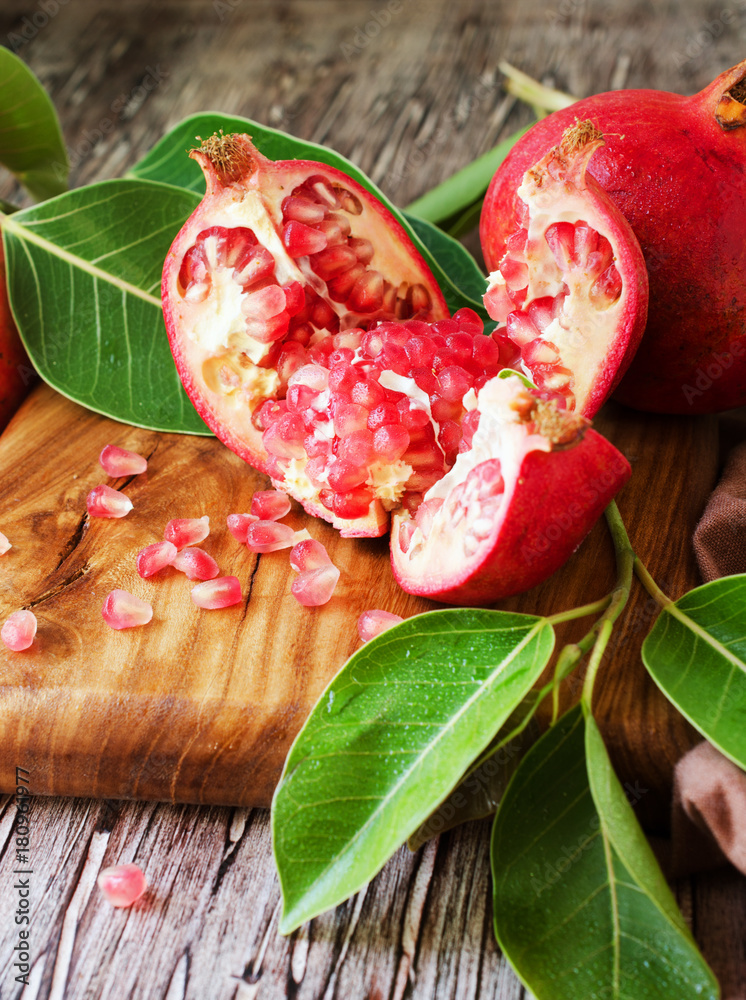 Fresh pomegranates and juice, selective focus Fresh pomegranates and juice, selective focus