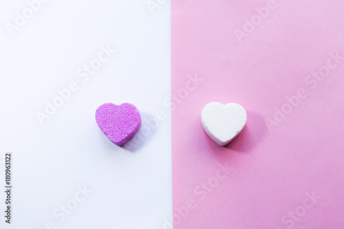 White and pirple candies in shape of heart photo