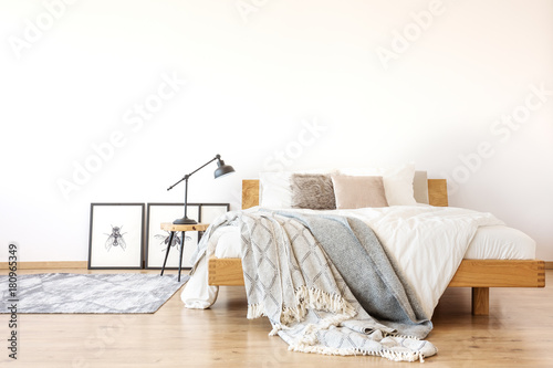 Wooden king-size bed in bedroom