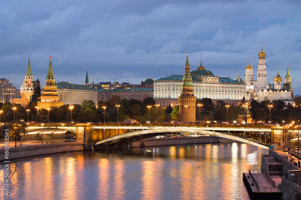 Moscow, Russia. Beautiful View Of Moscow Kremlin, Big Stone Bridge By Moscow River On Background Of Blue Hour With Clouds At Evening.