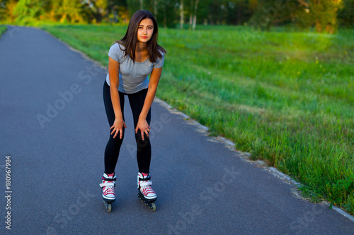 Teen girl roller-skating