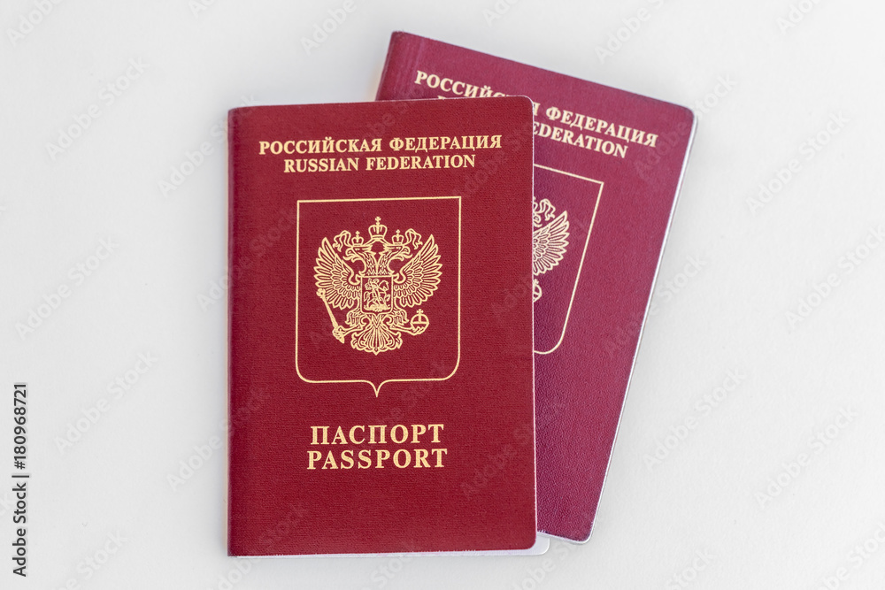 Two red Russian passports on a white background. Isolated Two red Russian passports on a white background. Isolated