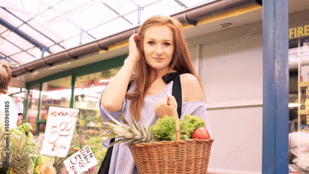 Portrait of beautiful woman with red hair at local farmers market
Portrait of beautiful woman with red hair at local farmers market