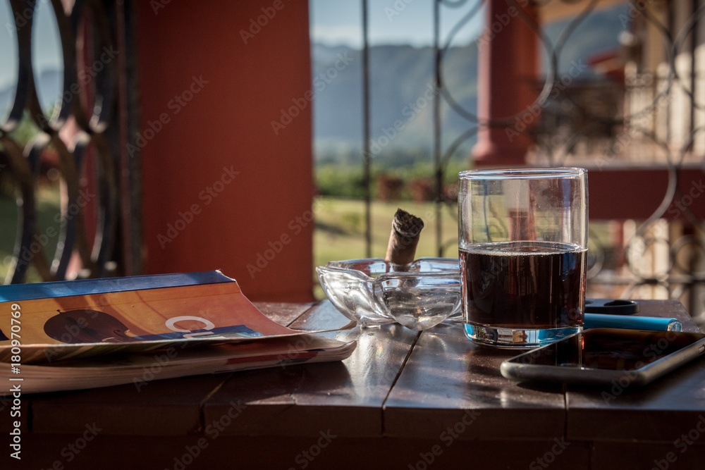 Book, cigar and cuba libre at Vinales, Cuba Book, cigar and cuba libre at Vinales, Cuba