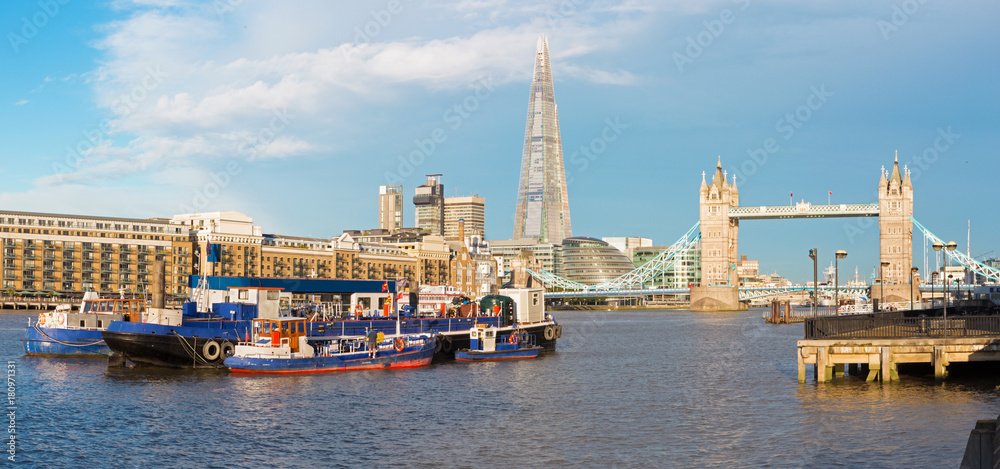 London - The panorama of the Tower bridge, riverside in morinig light.