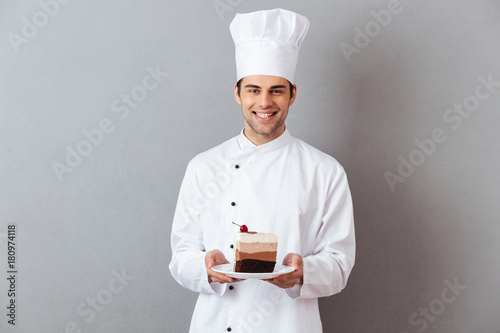 Photography Portrait of a happy male chef dressed in uniform