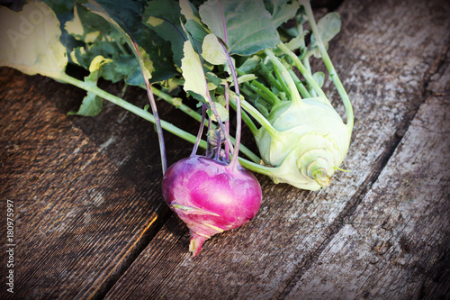 Fresh kohlrabi on the wooden table closeup photo