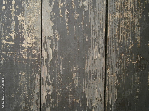 The surface of the wooden boards with peeling paint