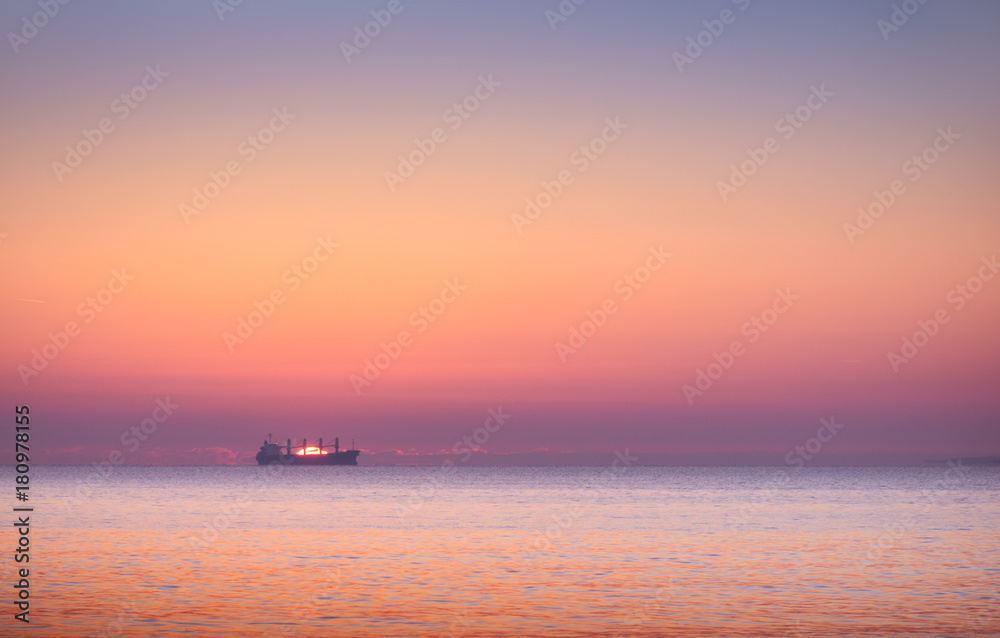 boat in the sea at sunset