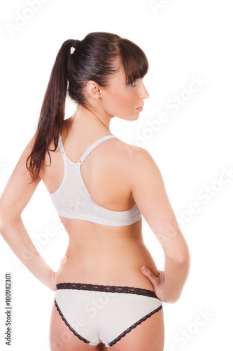 beautiful young woman with slim body in underwear isolated