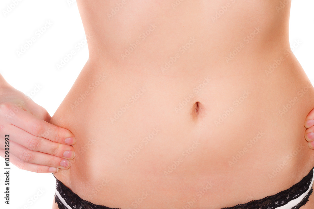 young woman is not happy about her figure, close up isolated young woman is not happy about her figure, close up isolated