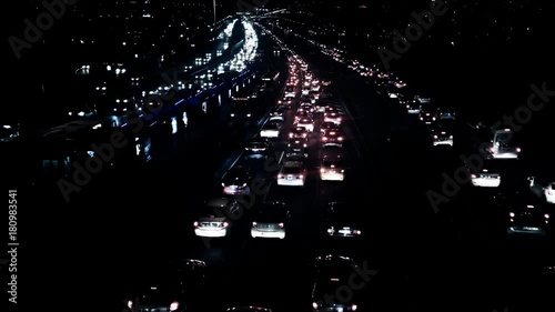 4k traffic timelapse, view of heavy traffic through bosphoros central business district that is located in the istanbul at night,It's the main hub for financialactivities in Turkey's capital city  photo