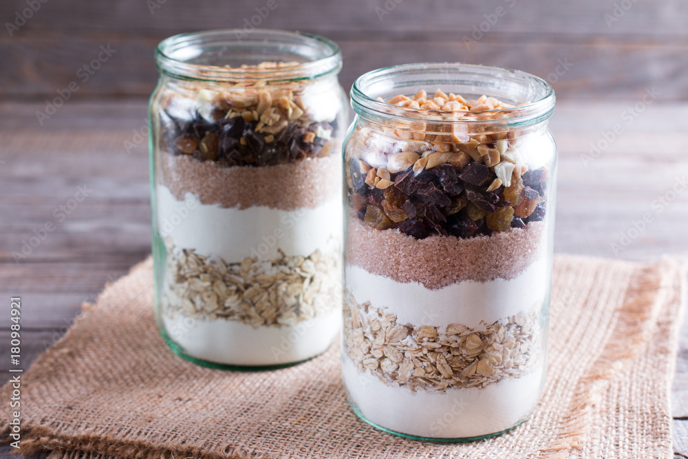 Mix of nuts in a jar. Mixing of ingredients for cookies in a jar Mix of nuts in a jar. Mixing of ingredients for cookies in a jar