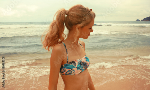 portrait young caucasian woman in swimsuit on the beach, Brazil