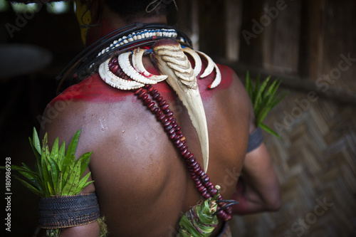 Male Huli wearing a hornbill beak around her neck, Papua New Guinea photo